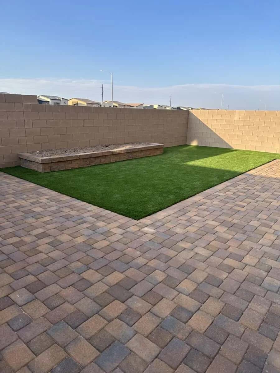 Backyard turf and paver patio